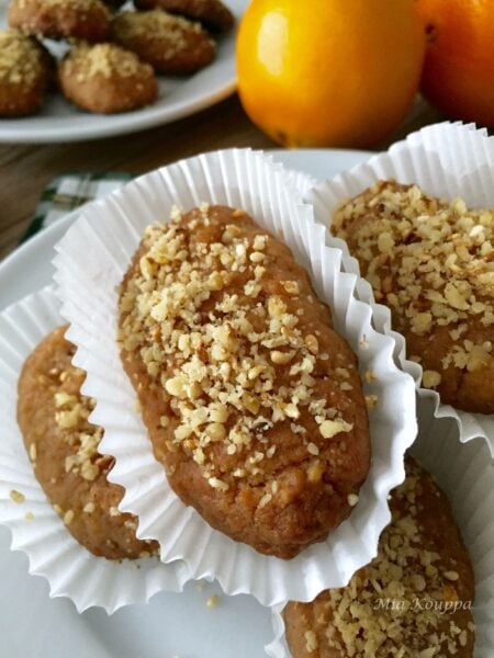 Melomakarona Greek cookies. These deliciously spiced, honey soaked, walnut topped Greek cookies just melt in your mouth.