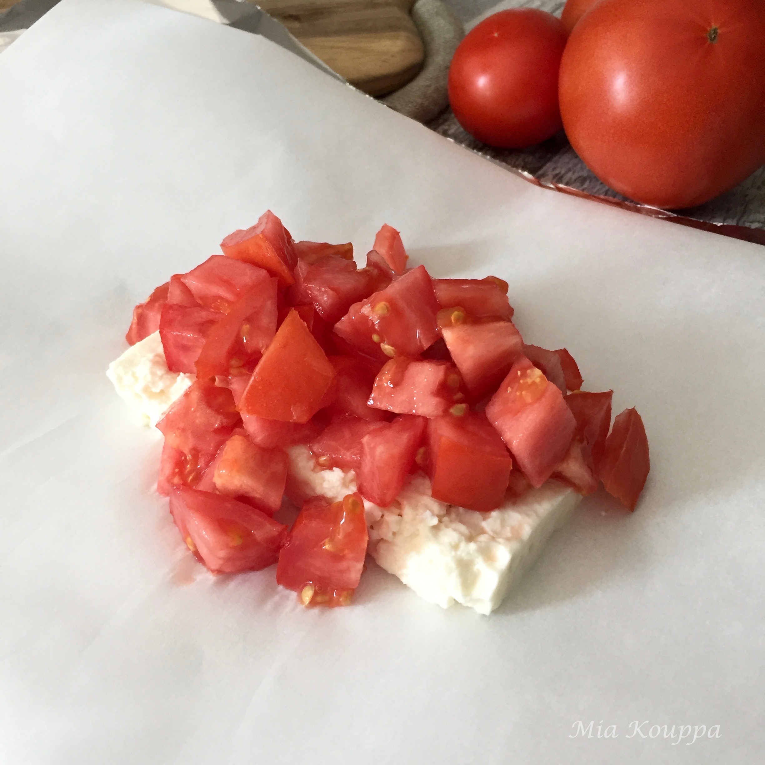 Warm feta packages, with tomatoes and olives