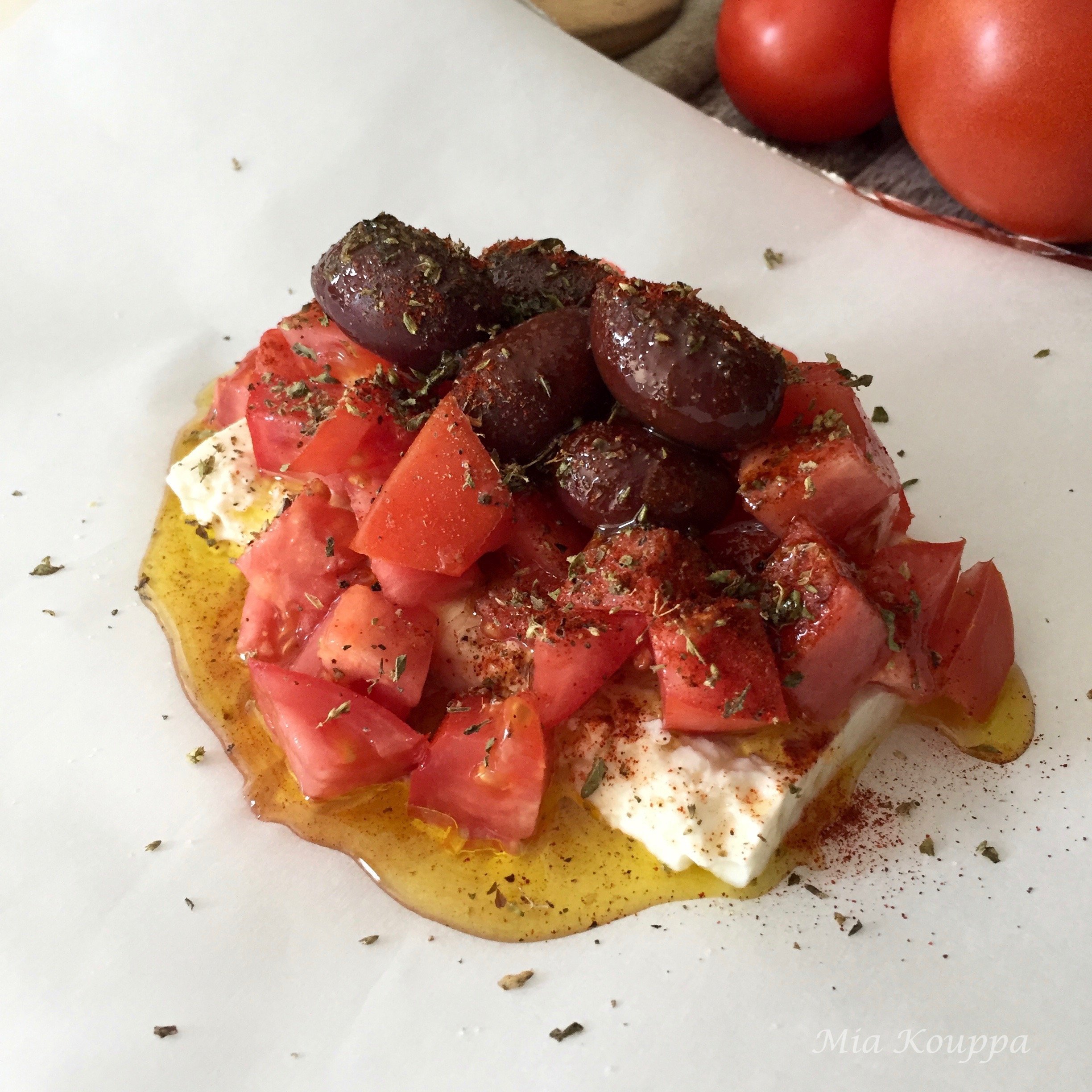 Warm feta packages, with tomatoes and olives