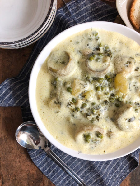 Artichokes and peas in an egg-lemon sauce