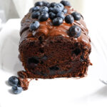 A vegan cake rich with chocolate flavour, blueberries and a chocolate glaze