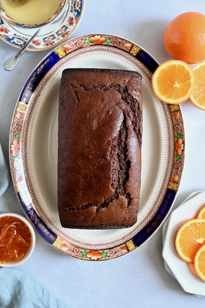 A vegan chocolate and orange cake served with an orange glaze