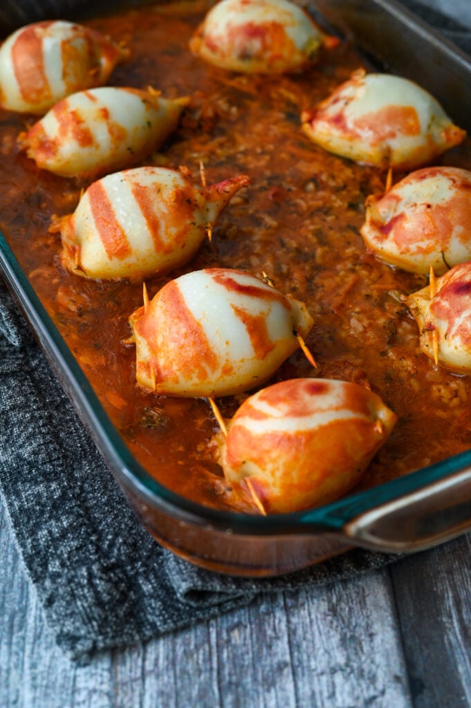 Baked squid stuffed with rice and herbs and baked in a tomato sauce.