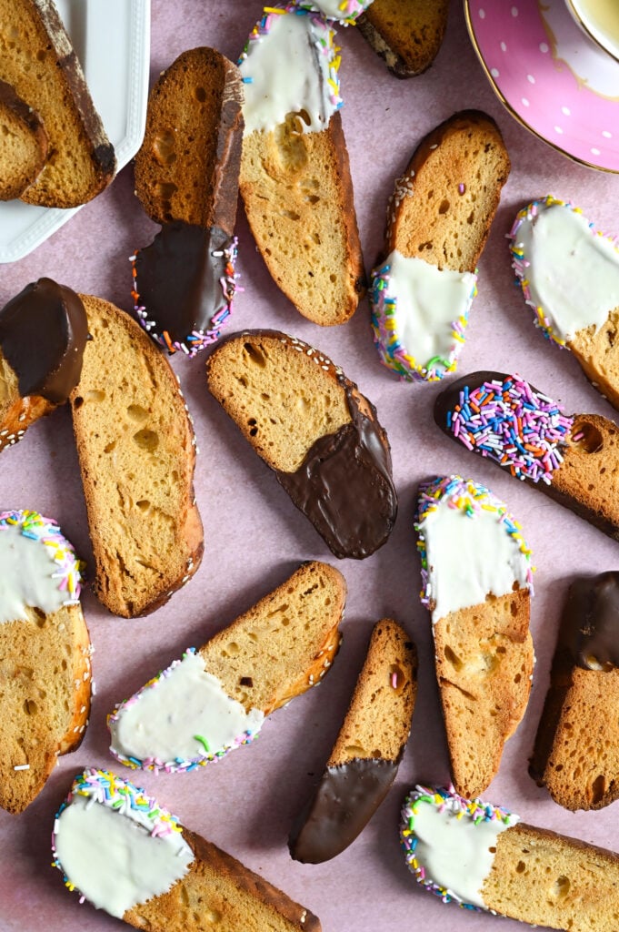 Greek biscotti, or paximadia, made with tsoureki bread and dipped in chocolate and sprinkles