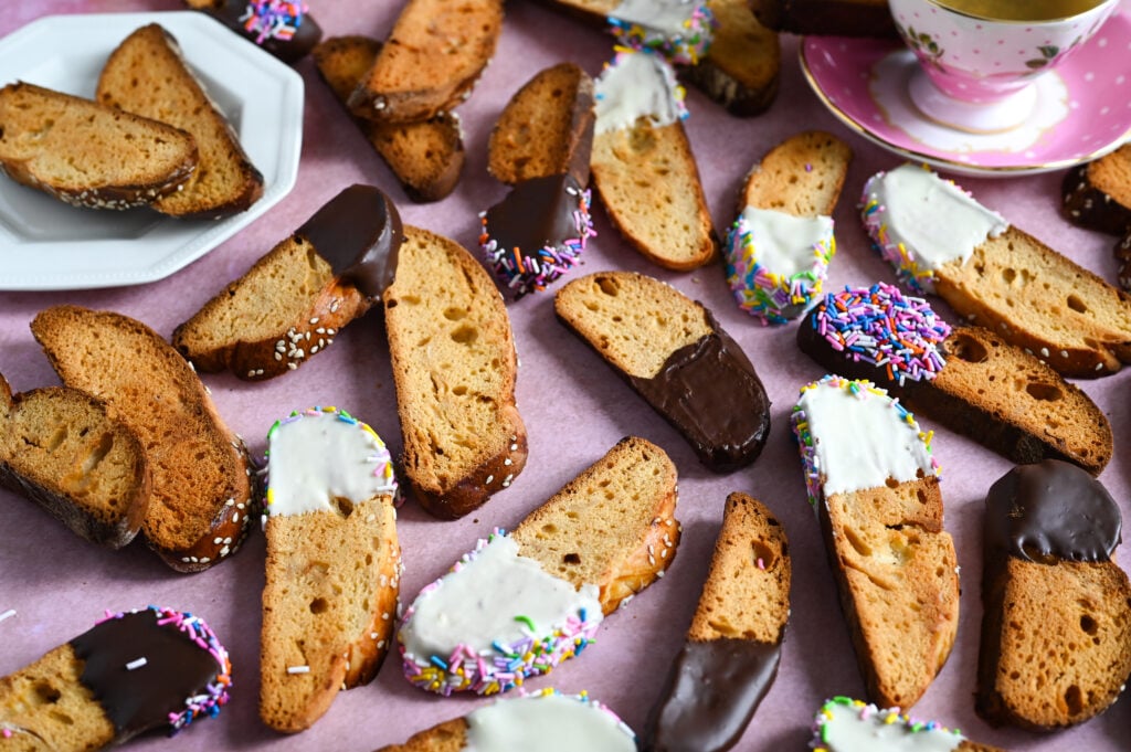 Greek biscotti, or paximadia, made with tsoureki bread and dipped in chocolate and sprinkles