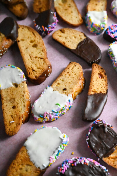Greek biscotti, or paximadia, made with tsoureki bread and dipped in chocolate and sprinkles