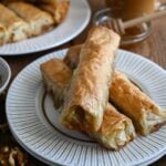 Saragli or Baklava cigars are a traditional Greek syrup soaked dessert make with phyllo dough and nuts