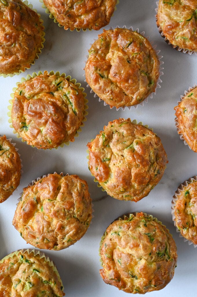 Savoury zucchini and cheddar muffins made with summer squash, aged cheddar and fresh herbs