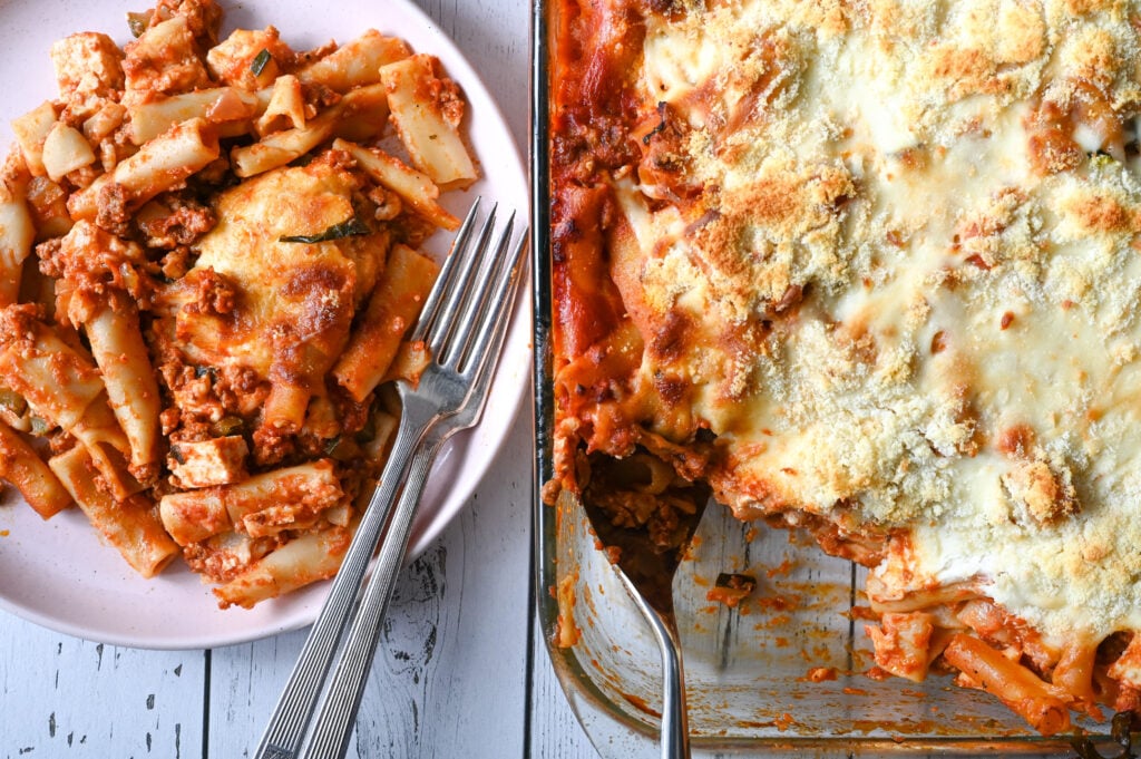 Easy baked ziti casserole with a Greek twist, full of cheese and a hearty meat sauce!