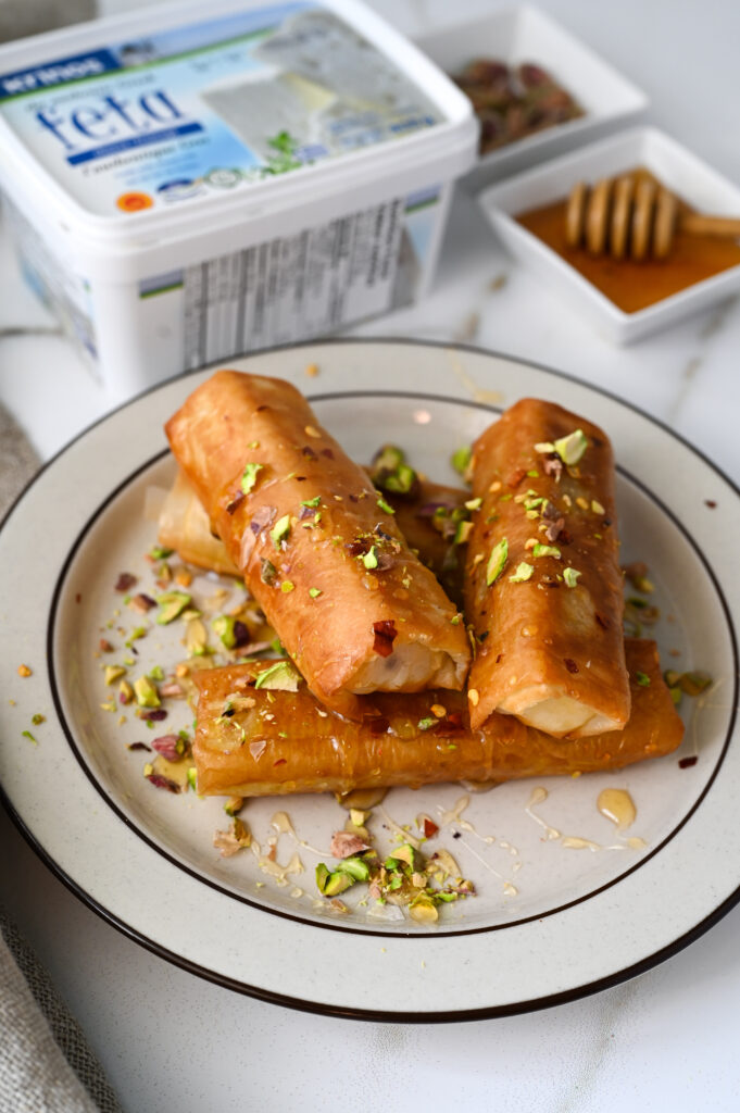 Fried phyllo wrapped feta with chili flakes, honey and crushed pistachios.