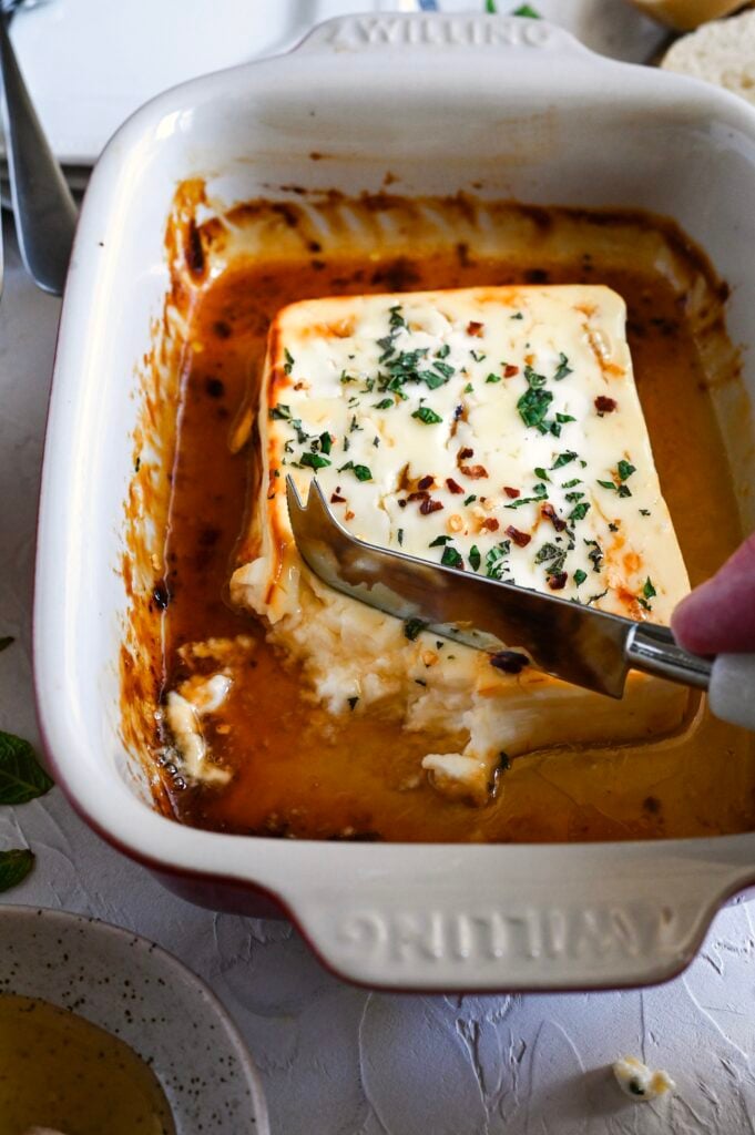 Baked feta with honey is a simple and delicious meze, perfect with crackers or bread.