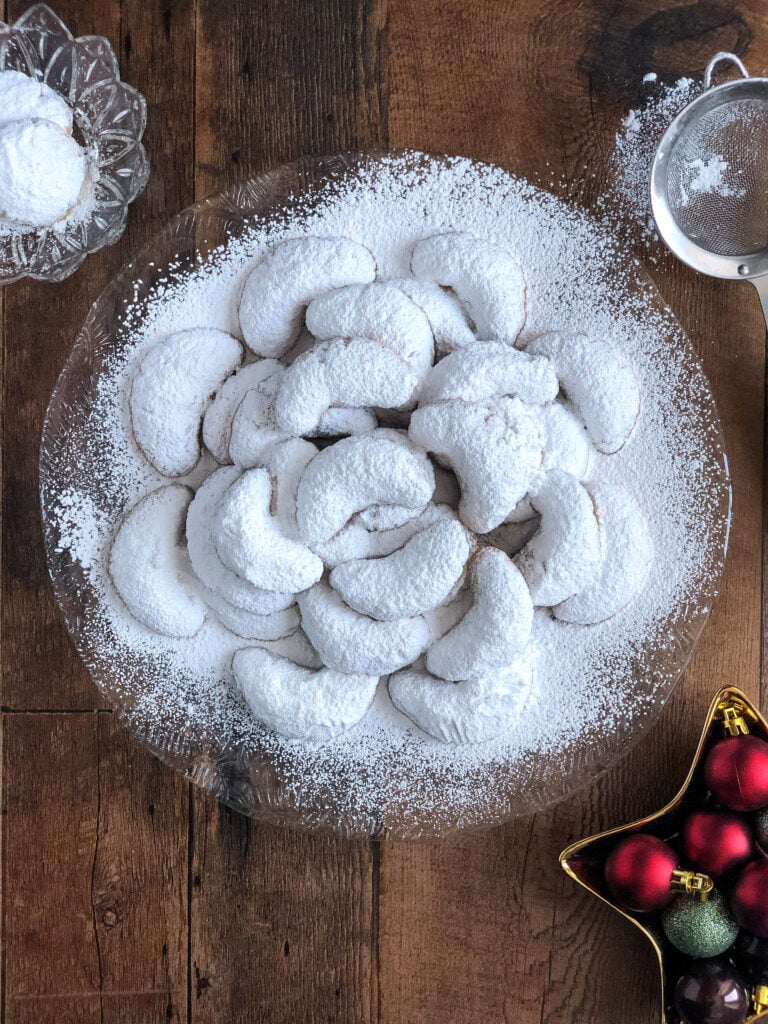 Kourabiethes (kourabiedes) are a Greek almond shortbread type cookie that is coated in icing sugar.