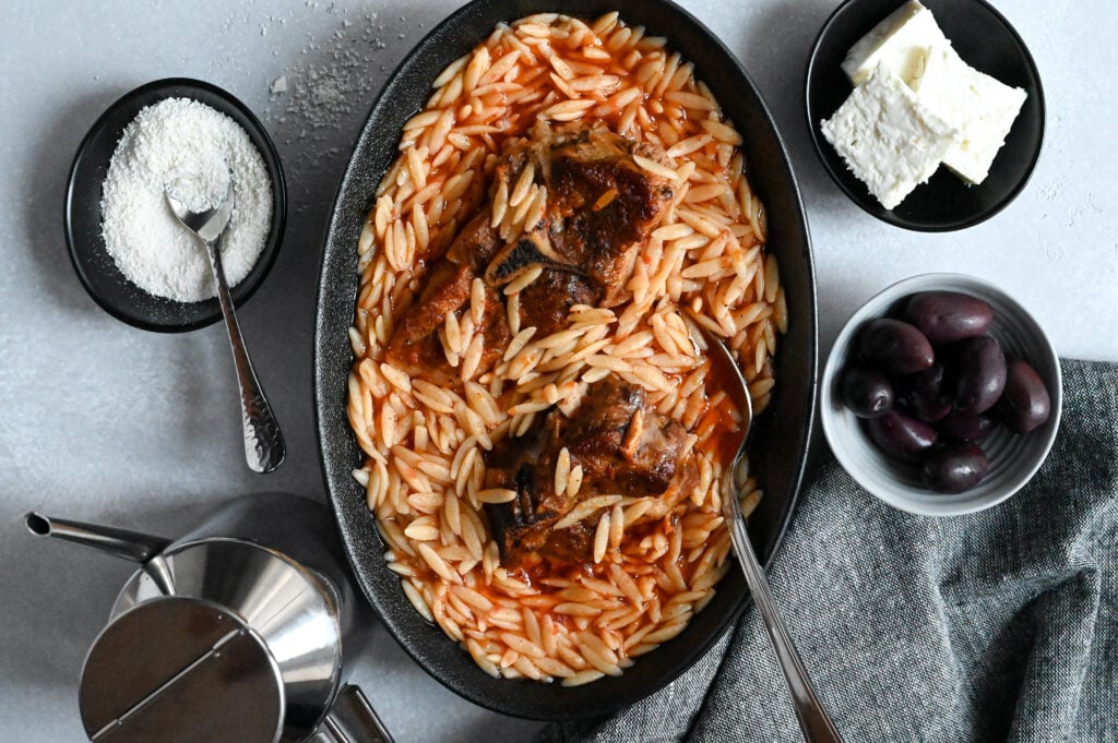 Youvetsi with lamb is a classic Greek slow cooked meal made with lamb and orzo.