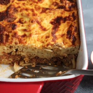 Pastitsio (also Pastichio) is a classic Greek pasta bake made with pasta, meat sauce and topped with béchamel.