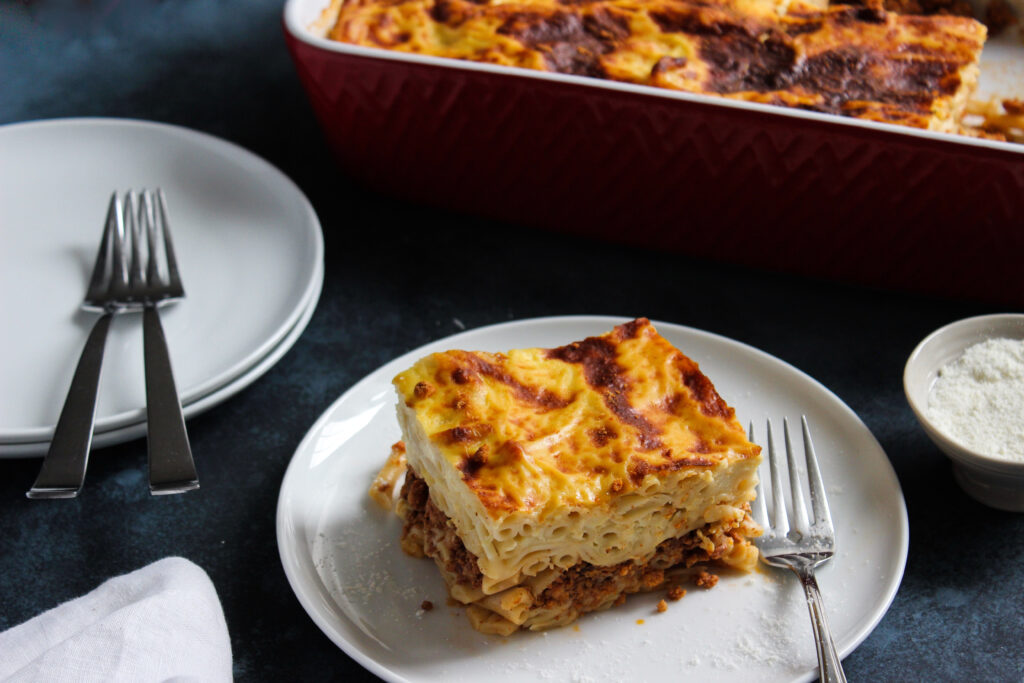 Pastitsio (also Pastichio) is a classic Greek pasta bake made with pasta, meat sauce and topped with béchamel.