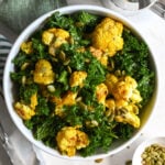 A delicious plant-based salad starring roasted cauliflower, chopped kale and with a wonderful vinaigrette