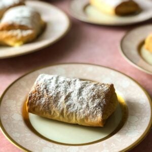 Bougatsa, cream-filled phyllo wrapped parcels sprinkled with icing sugar and cinnamon.
