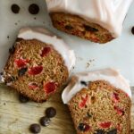 This maraschino cherry loaf cake is loaded with chopped up cherries and chocolate chips and topped with a pretty maraschino cherry flavoured cream cheese frosting.