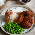 Soutzoukakia, a cross between burgers and meatballs, served in a rich tomato sauce and rice.