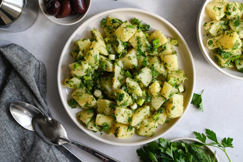 A Greek potato salad made with fresh herbs and a light lemon vinaigrette.