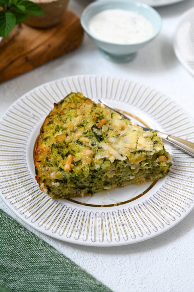 A delicious and easy crustless zucchini tart made with Greek cheese.