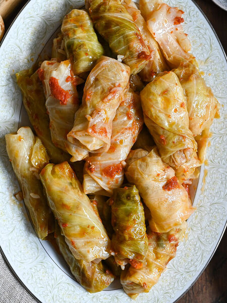 Lahanodolmades, Greek stuffed cabbage rolls with tomato sauce.