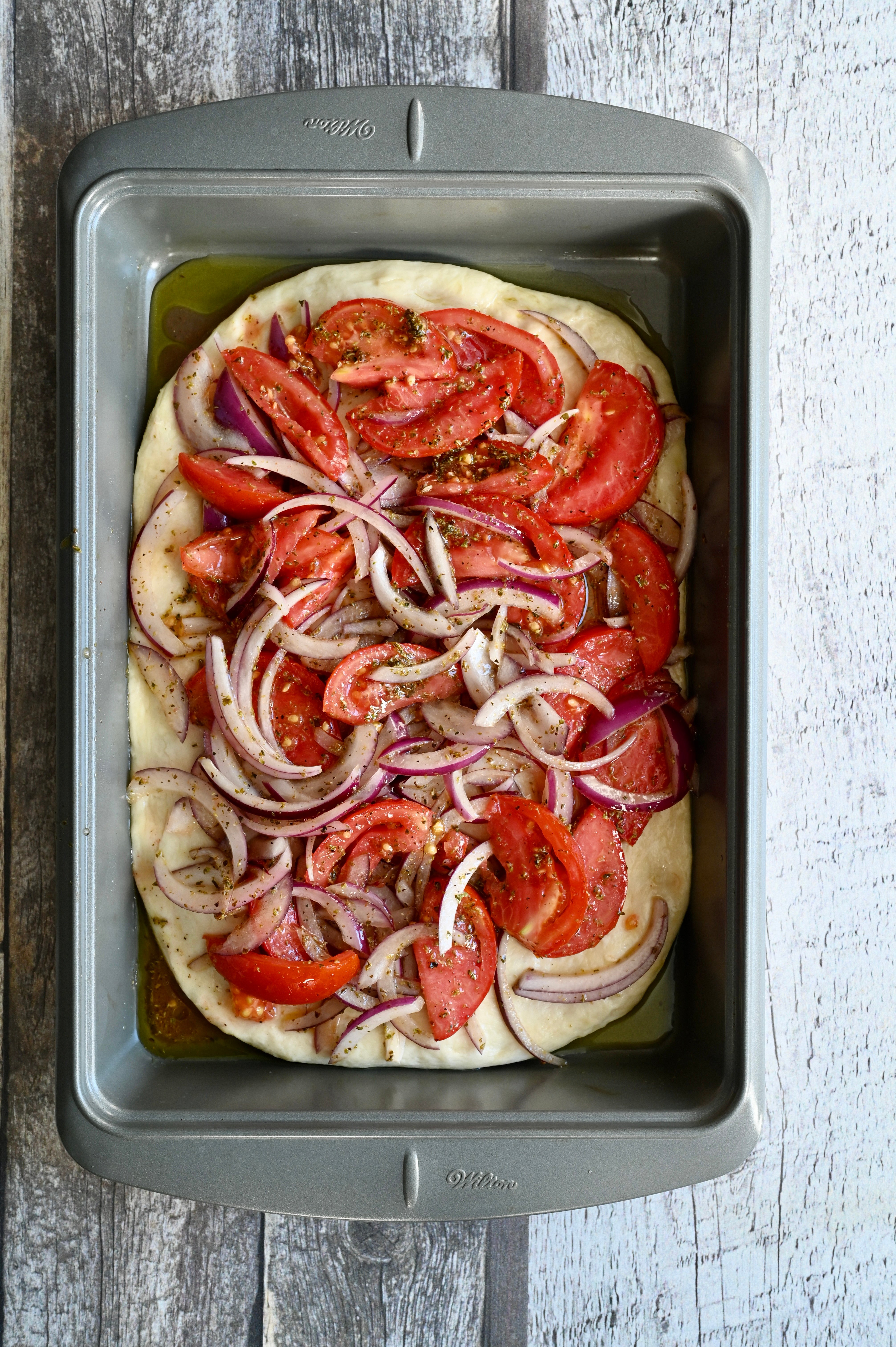 Ladenia, a Greek vegan tomato and onion flatbread.