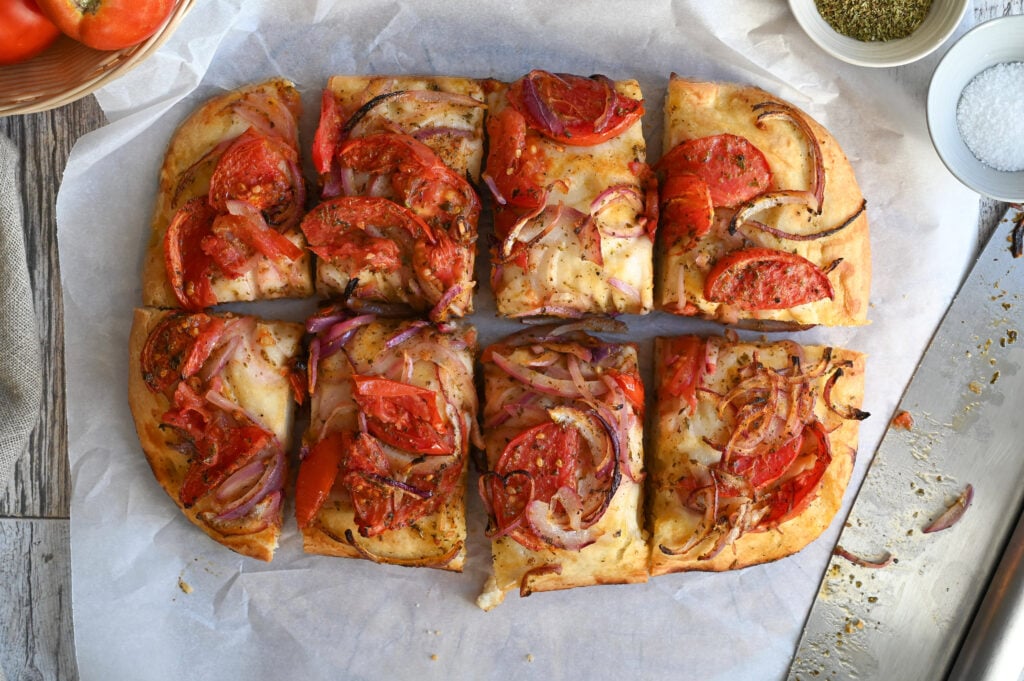 Ladenia, a Greek vegan tomato and onion flatbread.