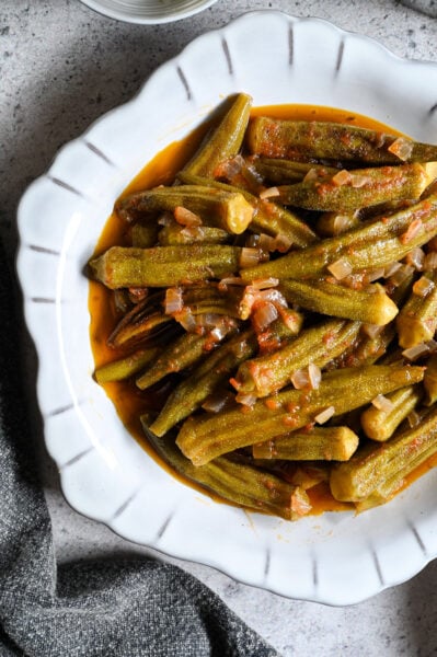 A traditional Greek side dish or main meal of okra stewed in tomato sauce, bamies latheres me domata.