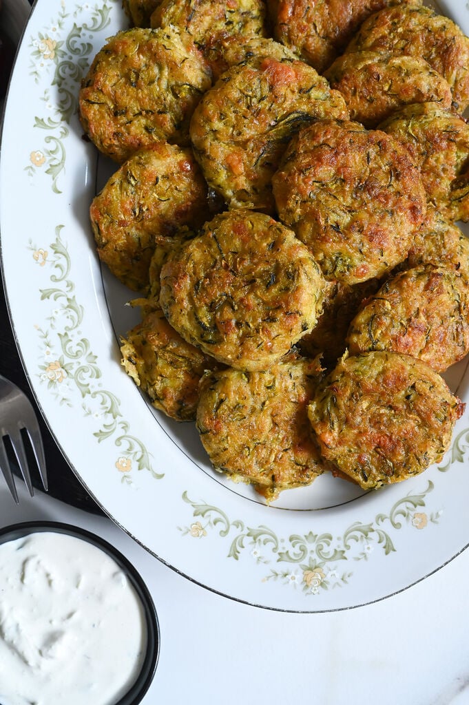 Kolokithokeftedes or Greek zucchini fritters made with feta and baked for a light snack or side.