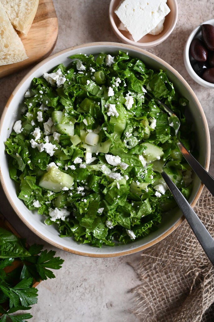 Maroulosalata is a classic Greek green salad prepared with finely chopped lettuce and plenty of fresh herbs.