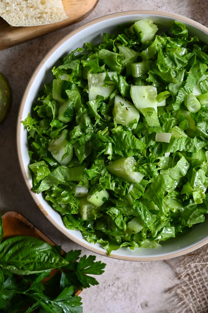 Maroulosalata is a classic Greek green salad prepared with finely chopped lettuce and plenty of fresh herbs.