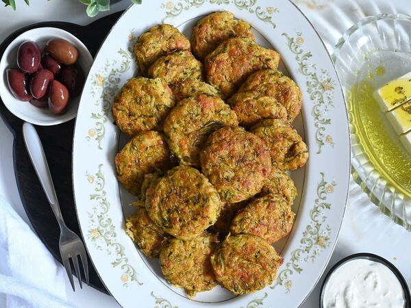 Kolokithokeftedes or Greek zucchini fritters made with feta and baked for a light snack or side.