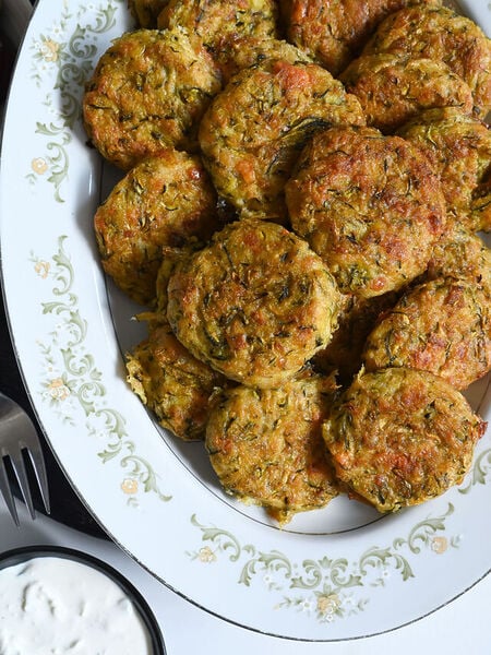 Kolokithokeftedes or Greek zucchini fritters made with feta and baked for a light snack or side.