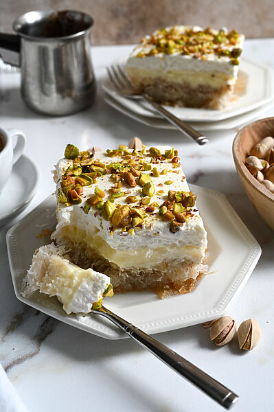 Greek Ekmek Kataifi - Custard and whipped topping dessert with syrup soaked pastry