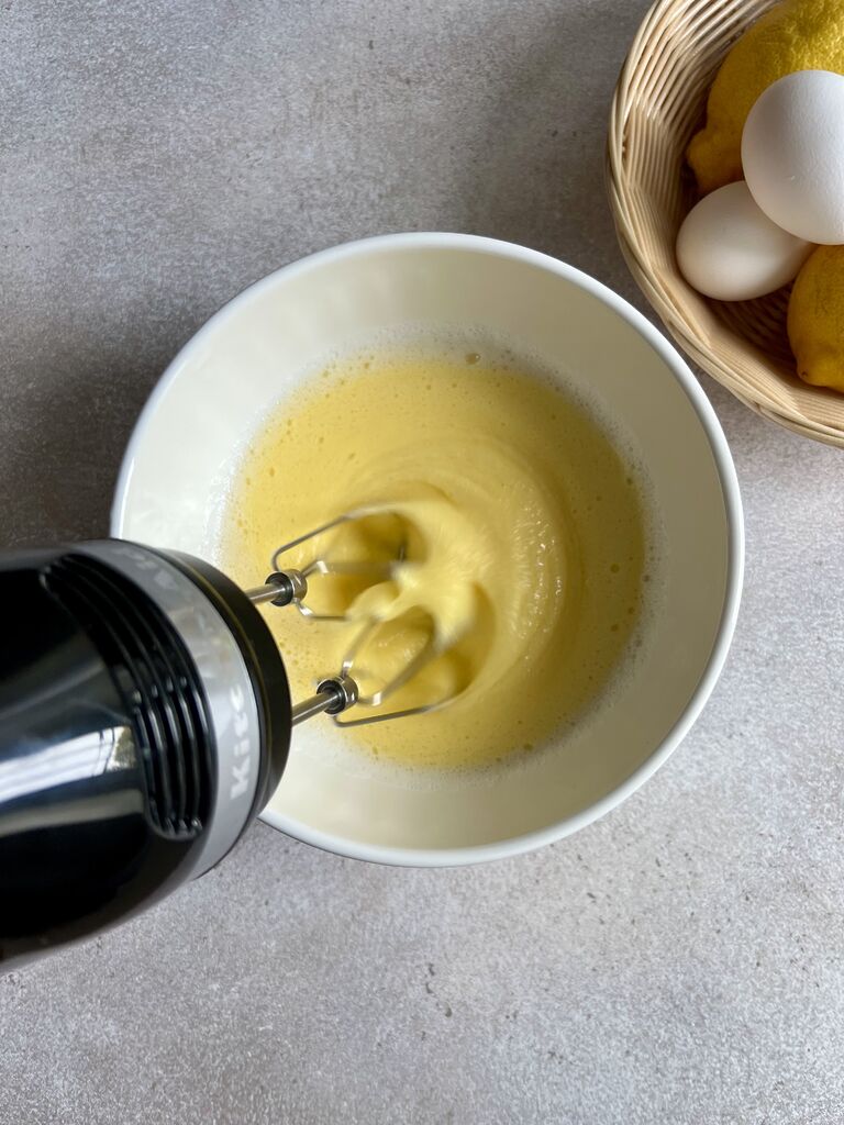 Adding the egg yolks to egg white mixture