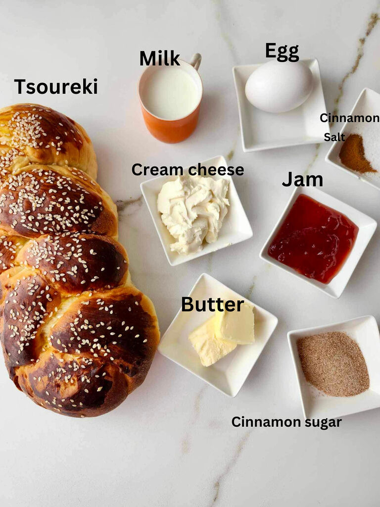 Ingredients for Tsoureki French toast sandwich with cream cheese and jam; ingredients include: Tsoureki, milk, egg, cream cheese, jam, cinnamon, salt butter and cinnamon sugar