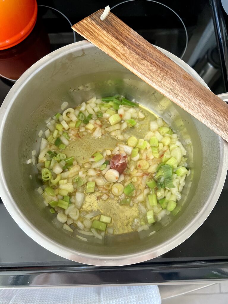 Cooking of the spinach and potato stew.