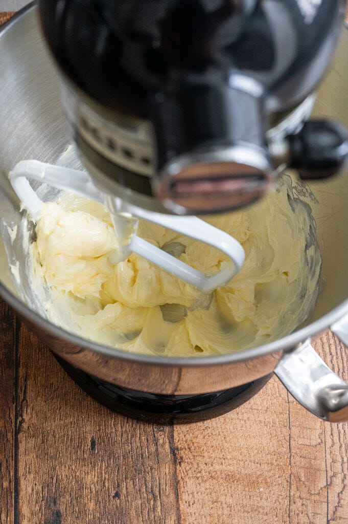 Beating the butter.