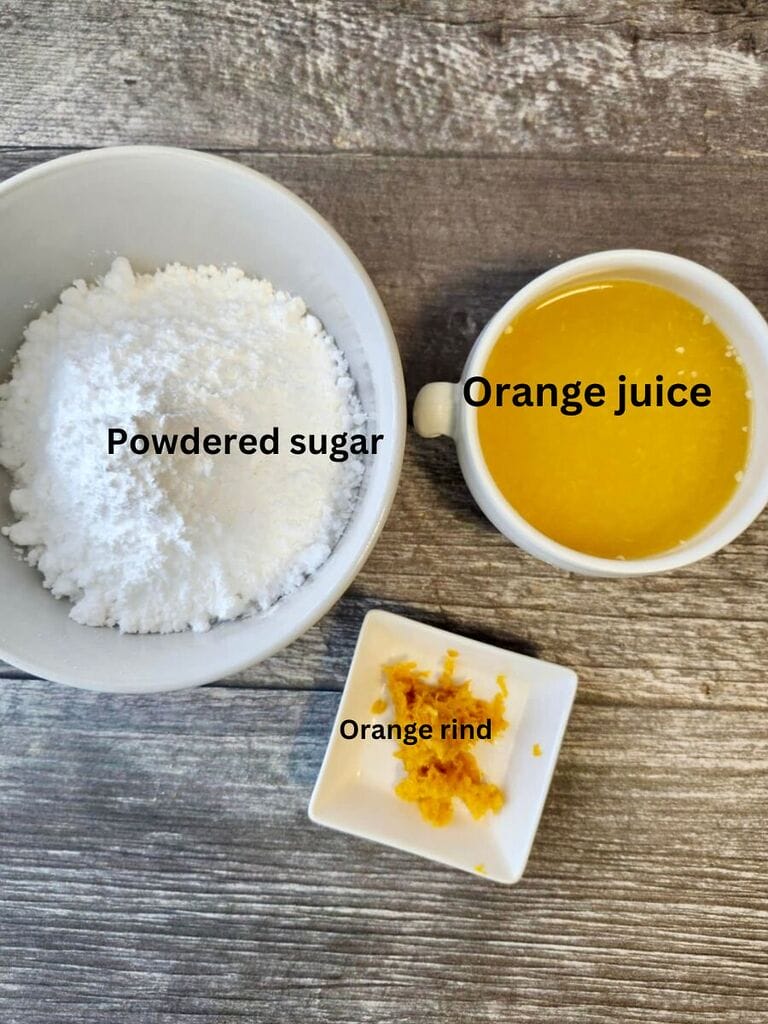Ingredients for the glaze, which include powdered sugar, orange juice and orange rind