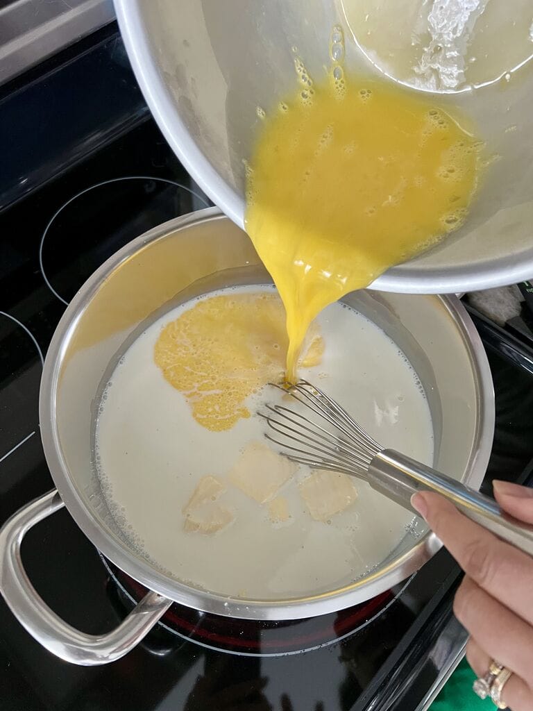 Add the eggs to the custard mix.
