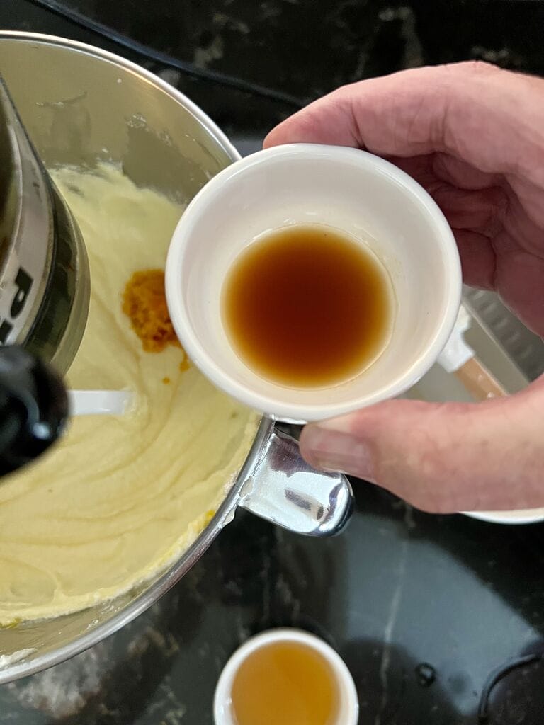 Adding the vanilla into the batter.
