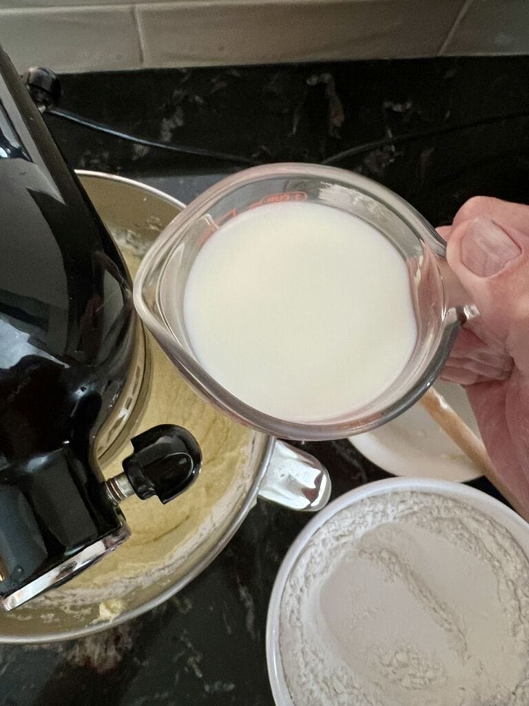 pouring milk into the batter