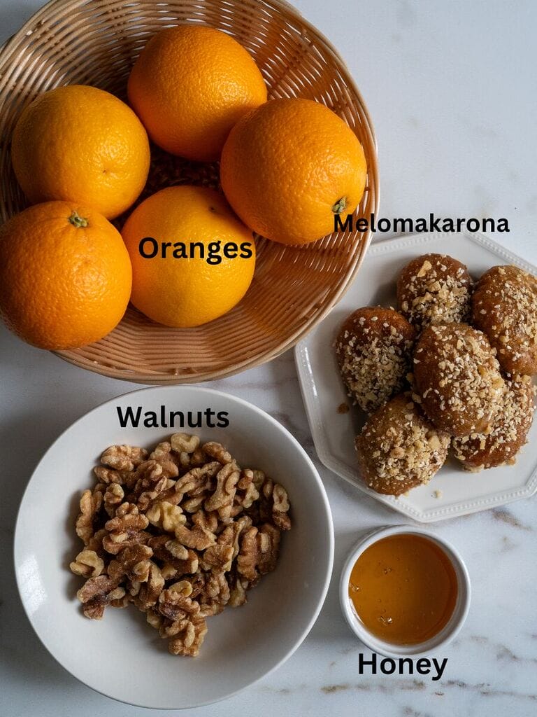 Ingredients for the Greek melomakarona trifle which include oranges, walnuts, honey and Melomakarona.