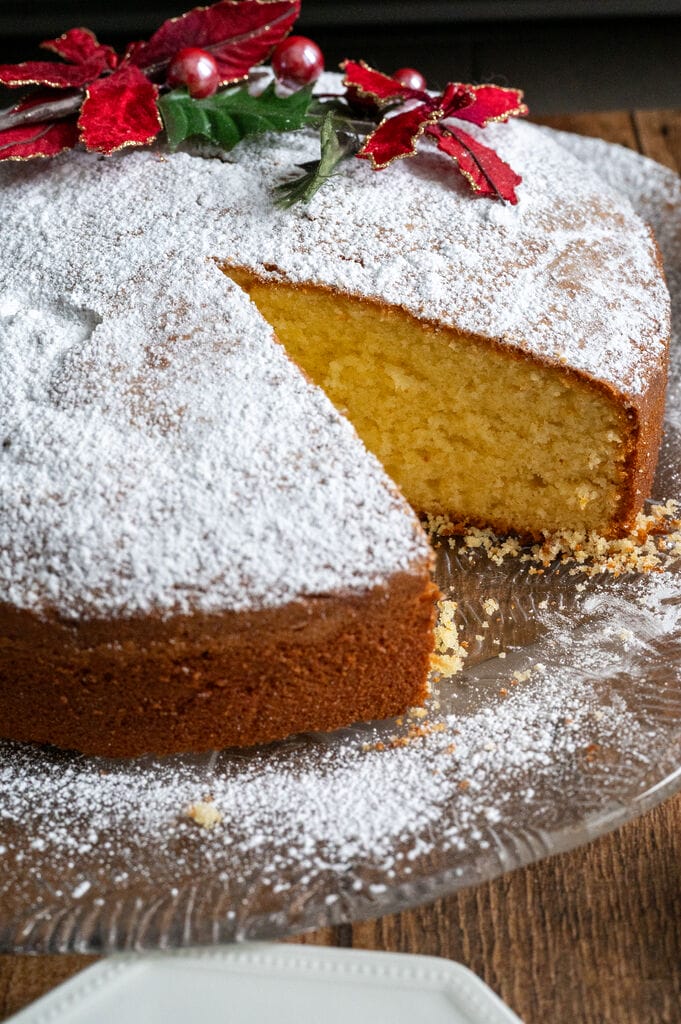 Vasilopita or Greek New Year Cake (Βασιλόπιτα), showing a piece cut out of the cake.