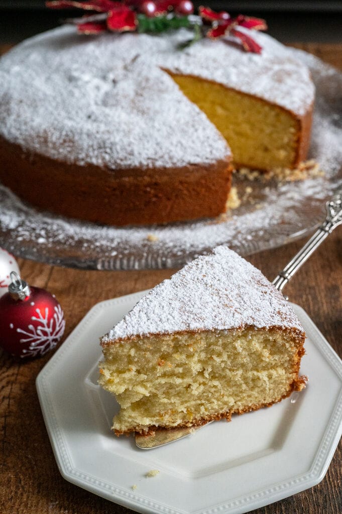 Vasilopita or Greek New Year Cake (Βασιλόπιτα), a piece on a white plate.