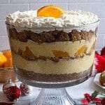 Completed Greek melomakarona trifle in a glass trifle bowl.