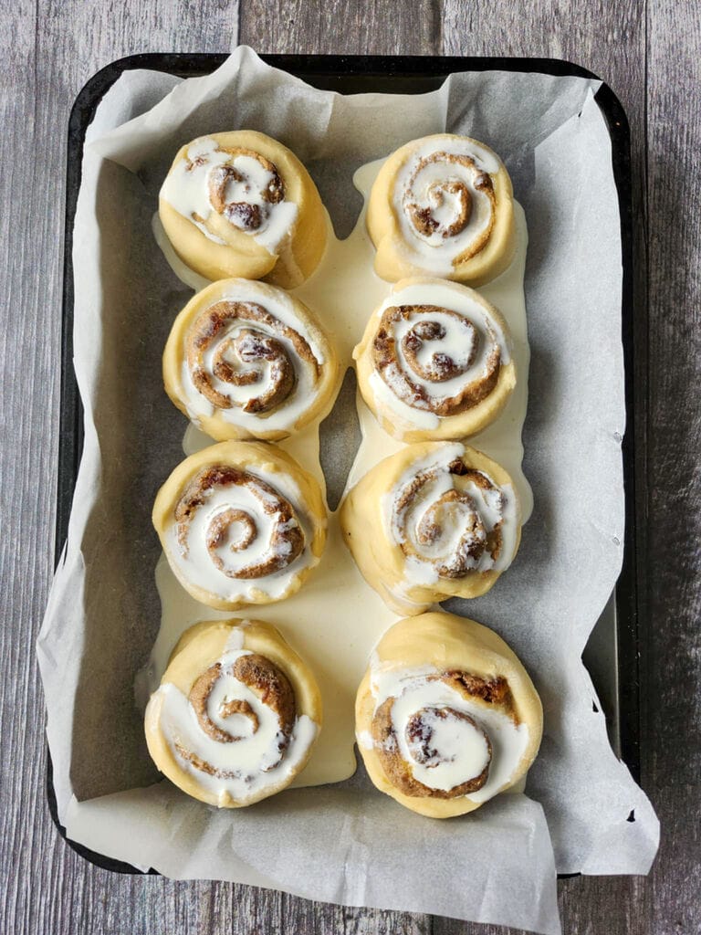 Sticky toffee cinnamon buns with dates ready to bake.