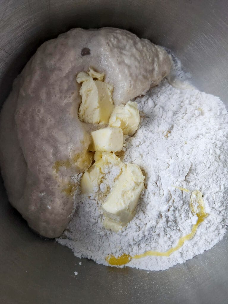 Combining the yeast mixture with the butter and flour.