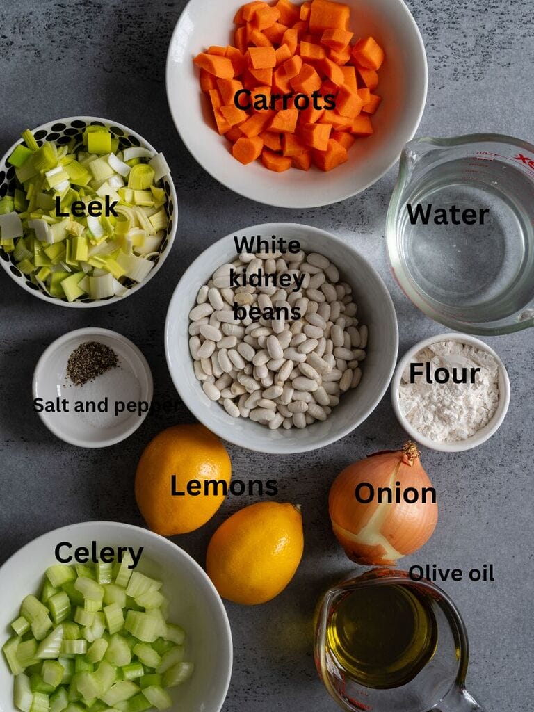 Ingredients for Fasolatha soup which include: White kidney beans; leek, carrots, water, onion, salt, pepper, flour, lemons, olive oil and celery.